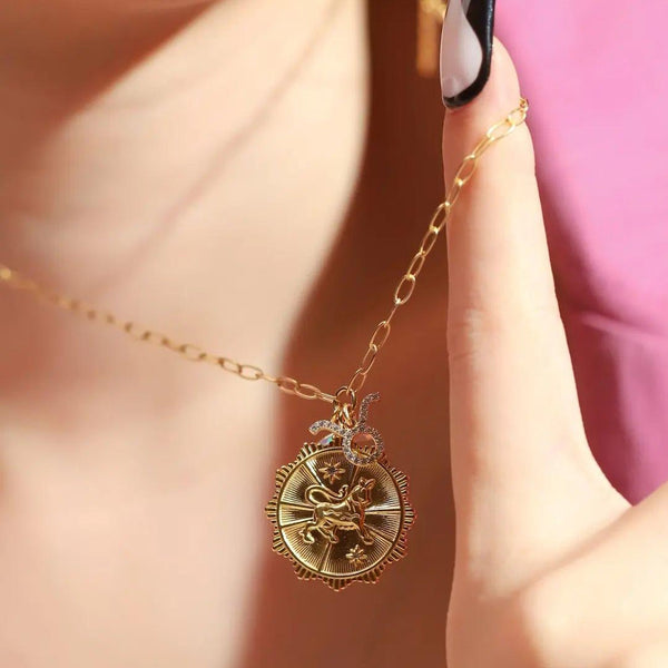 This zodiac necklace is the perfect addition to your jewelry collection, as it adds a personalized touch to any outfit. Alongside a moon pendant and zodiac symbol, this is the perfect gift for someone or yourself. Comes in all zodiac signs. 
